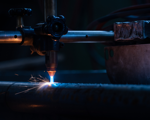 Plasma cutting pipe operator cuts torch
