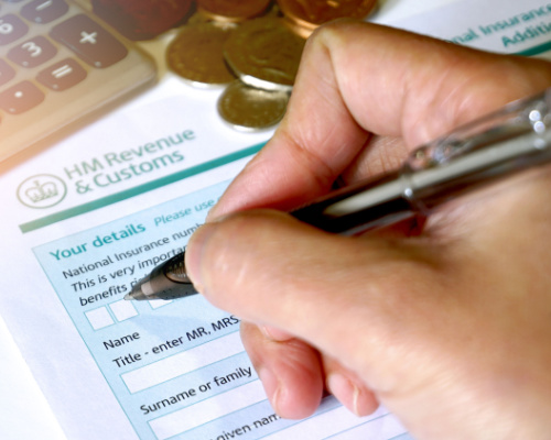 Person filling in a tax form