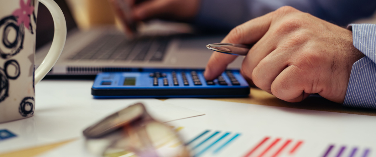 Businessman calculating tax loan