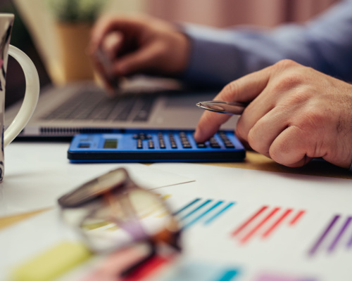 Businessman calculating tax loan